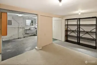 View looking back toward the utility room, from the other side of the roomy basement. Finished or not, you're going to love all the options for this space!