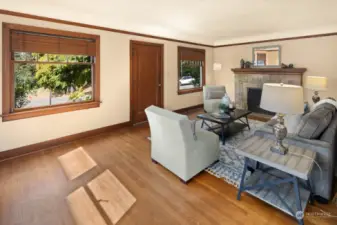 Looking from the dining room back toward the entrance door and fireplace.