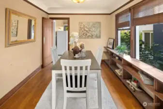 Custom built-in shelving lines the length of the dining room.