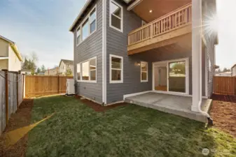 Rear Yard with covered Patio and Covered Private Balcony off Primary