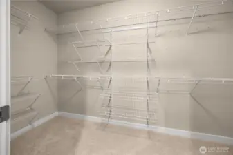 Extra large closet and shelving just feet off of the primary bathroom for convenience.