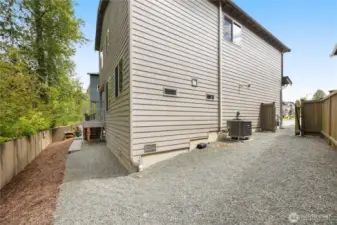 Side of the home has gravel