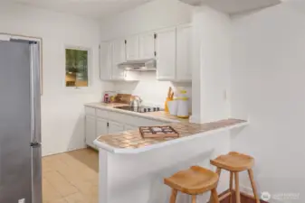 The second kitchen with eating space on lower level, perfect for nanny, guests or extended family.