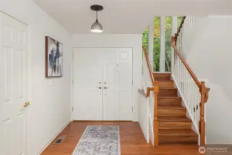 The foyer brings you into this lovely home, with rich hardwood floor.