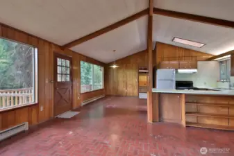 Spacious main living area. Door in the back goes to the carport.