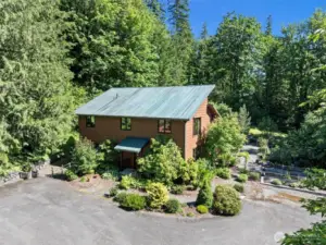 Welcome Home to over 9 acres of forest and gardens!