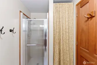 Main level 3/4 bathroom with linen closet