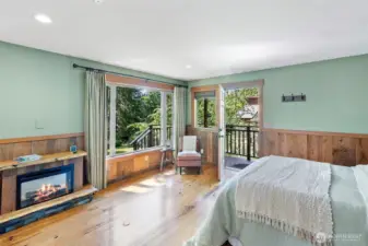 Studio cottage with custom mantle over electric fireplace.