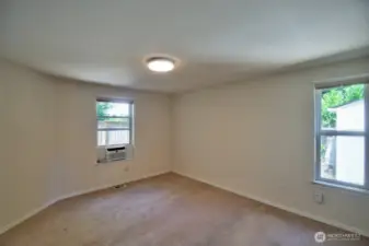 Another view of the primary bedroom showing AC unit.