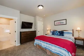 Primary bedroom with view of bathroom
