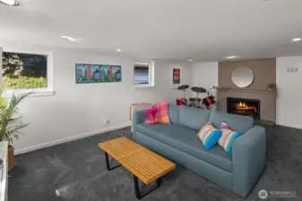The lower level rec room features a wood burning fireplace.