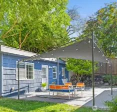 This is the detached studio apartment DADU. The patio is between the main house and the studio. It has a separate path and gate for access.
