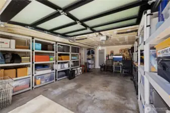 The extra deep garage has room for a car PLUS lots of storage. There's a workbench on the right. The spacious laundry room is off the back.