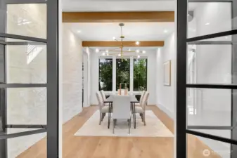 French doors open to the formal dining room
