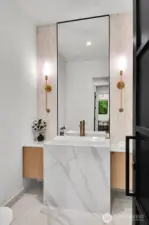Main level powder room with waterfall quartz countertop