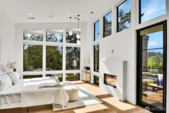 Primary bedroom with gas fireplace and private deck