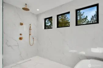 Three shower heads are found in the Primary bathroom