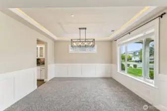 Formal dining or sitting area, this room has tons of natural light and flexible use options