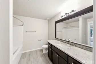 Basement full bath. Enter from the hallway or the basement bedroom