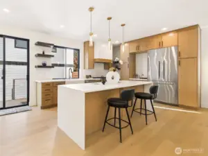 Custom cabinetry, Waterfall countertop, Thermador Appliances