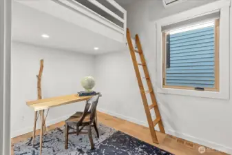 Just off the main living area, bedroom w/ loft and a handcrafted white oak ship ladder offers flexibility or creative use.