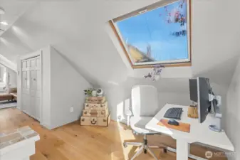 Upstairs, skylit office nook in lofted primary suite.