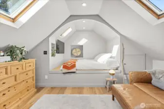 Upstairs, the lofted primary suite is a peaceful haven with a lounge and queen-sized sleeping loft (w/ room for expansion) framed by skylights — a tranquil perch for stargazing.