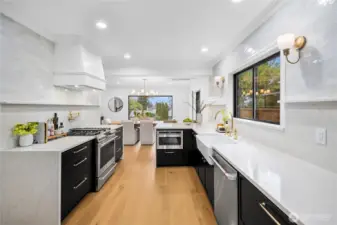 Another view of the kitchen - you will LOVE the brushed gold pot filler above the gas range!