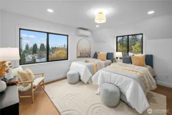 This is the 3rd upper level bedroom with a view towards the Sound! Through this bedroom is access to a very special attic retreat...