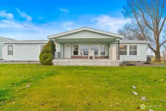Covered front porch perfect for enjoying evening sunsets.
