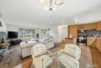 Open concept living featuring living room, dining area, and kitchen!