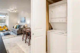 In-unit washer and dryer are tucked in a closet out of sight, and are included in the sale.