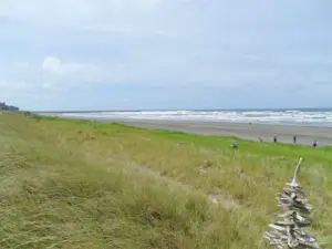 Southwest View of the Beach and Ocean ~ looking towards the Jetty (taken in 2022).