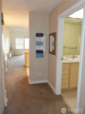 Leading from the front bedroom to the bathroom on the right, and then into the Open Great Room.