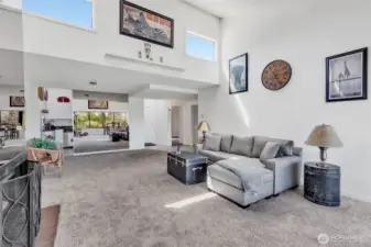 Looking west towards kitchen and dining area.  Note vaulted ceiling and clearstory windows above.