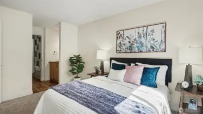Primary bedroom showing sink vanity and bath.