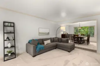 Living room flows seamlessly into the dining room.