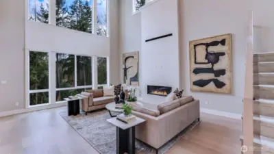 All photos seen for Lot #4 are of the Model Home (Lot #3). Awe-inspiring Great Room with its mesmerizing 20' ceiling, sleek modern fireplace framed by breathtaking floor-to-ceiling custom tile work!