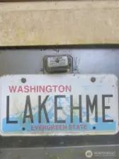 License plate to RV parked up by lakefront!