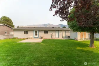 Spacious fenced in backyard with plenty of room for a hot tub or pool