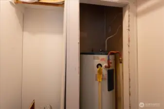 Hot water tank located in second bedroom closet