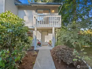 East-facing front porch with second bedroom balcony above
