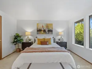 Primary bedroom with ample space and natural light