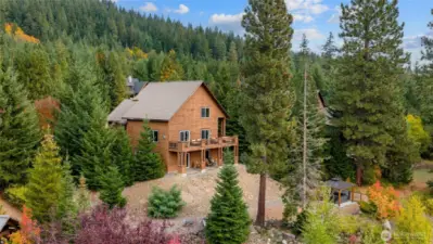 Set on a spacious ½-acre lot, the home maximizes the slope of the land and its stunning views.”