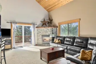 Double sliding doors from the living and dining areas open onto a expansive wraparound deck.