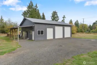Well-maintained outbuildings provide flexible storage.