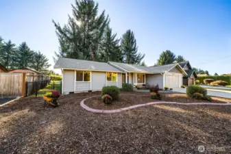 A second view of the front of the home shows the easy access to the back yard, (gates on both sides of home), and a fresh front yard canvas ready for your drought resistant landscaping scheme or garden plantings.