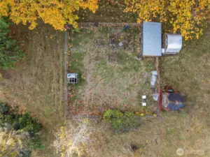 The garden area fenced, and the pilots very own Alaska Airlines Cargo Chicken Coop and run.
