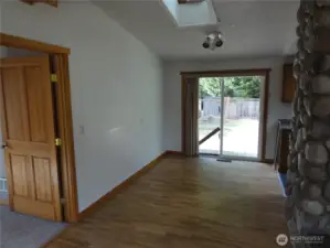 Eating area off kitchen. Primary bedroom to the left.