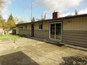 Huge, fenced, back yard off back of home. Alley access with carport.